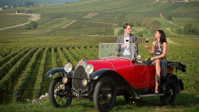 Couple seated on Bugatti Vineyard tasting Route Des Grands Crus